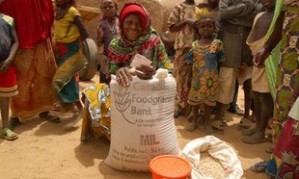 Ramatou Malon Hassan, a widow and mother of twelve in Niger, receives millet from CFGB to help her sustain her family through a crisis.
