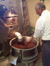An employee of Cafe Justo demonstating how coffee is roasted in Agua Prieta